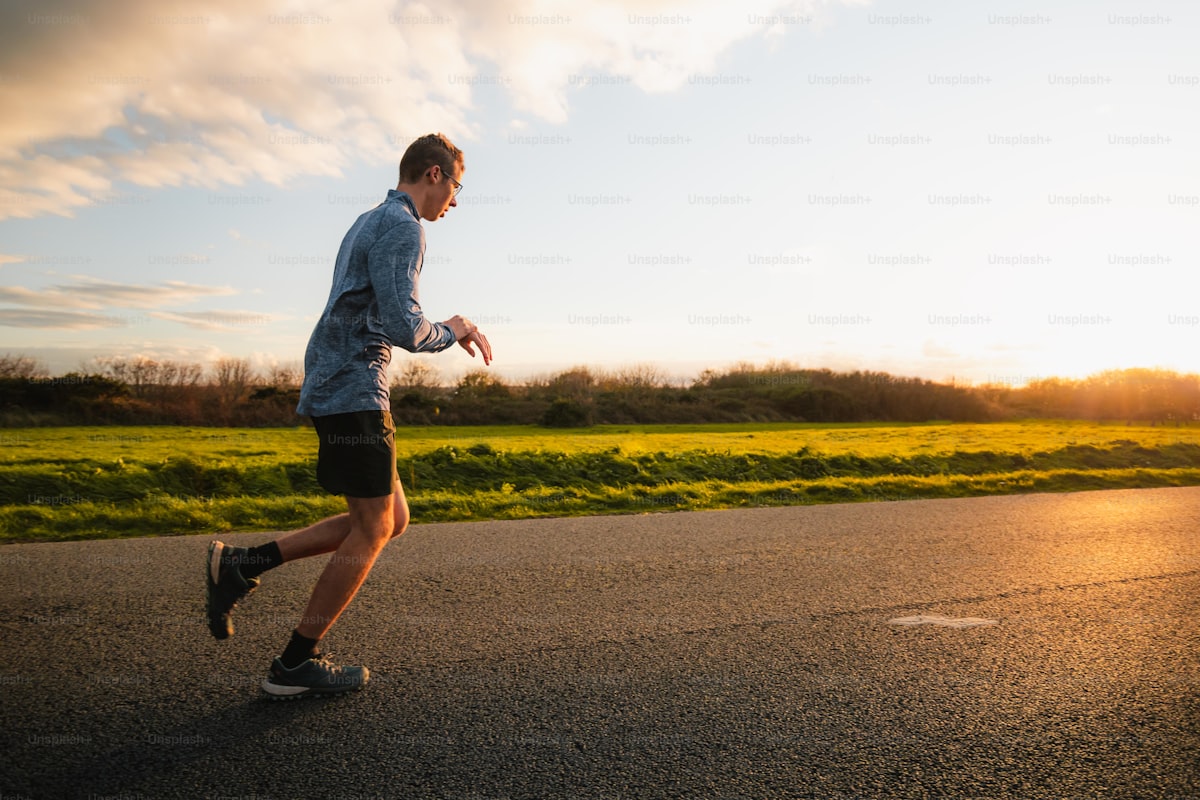 Athlete running outdoors on road during fartlek training
