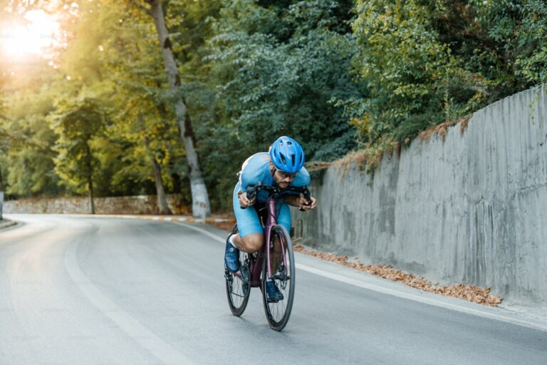 Triathlete cycling on outdoor road